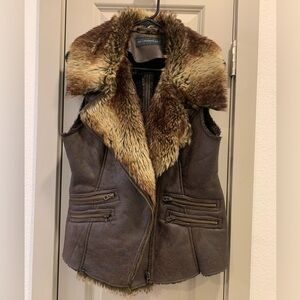 Gorgeous vegan leather, faux fur collared and lined vest. Zip with zip pockets